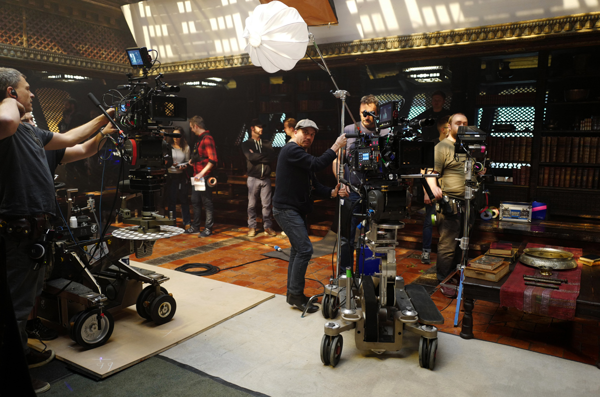 A scene of the crew on the set of Doctor Strange setting up the lighting and cameras for a scene