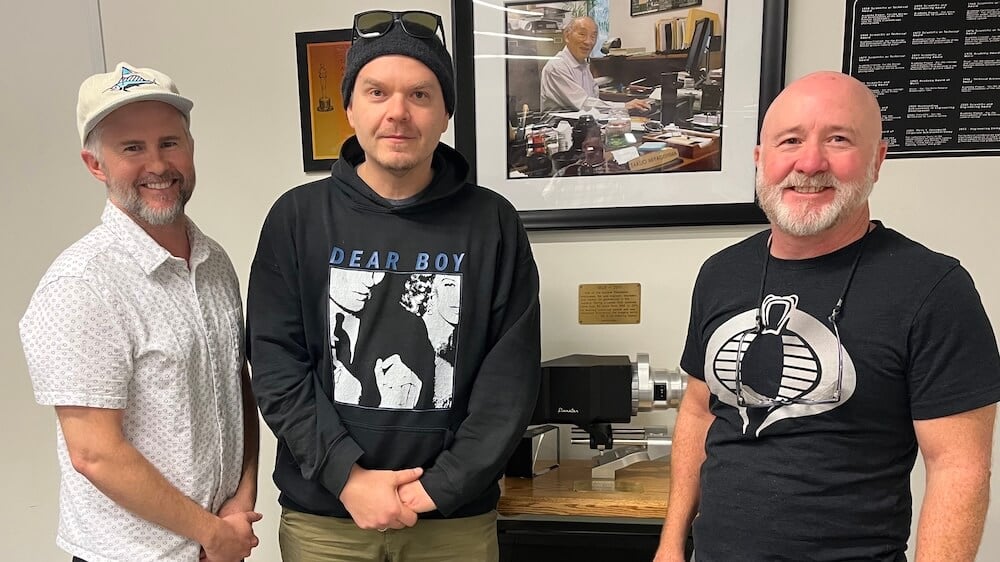 Panavision's Mike Carter (left) and Brian Mills (right) with cinematographer Pawel Pogorzelski