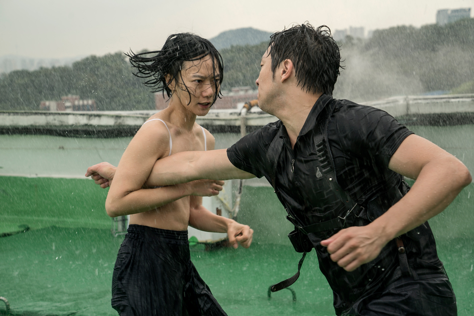 Bae Doona and Son Suk-ku fighting in the rain on a rooftop, from Sense8